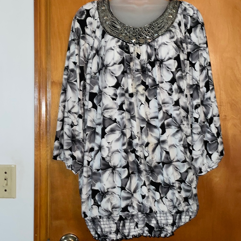 Black gray and white floral patterned top with beautiful decorative neckline